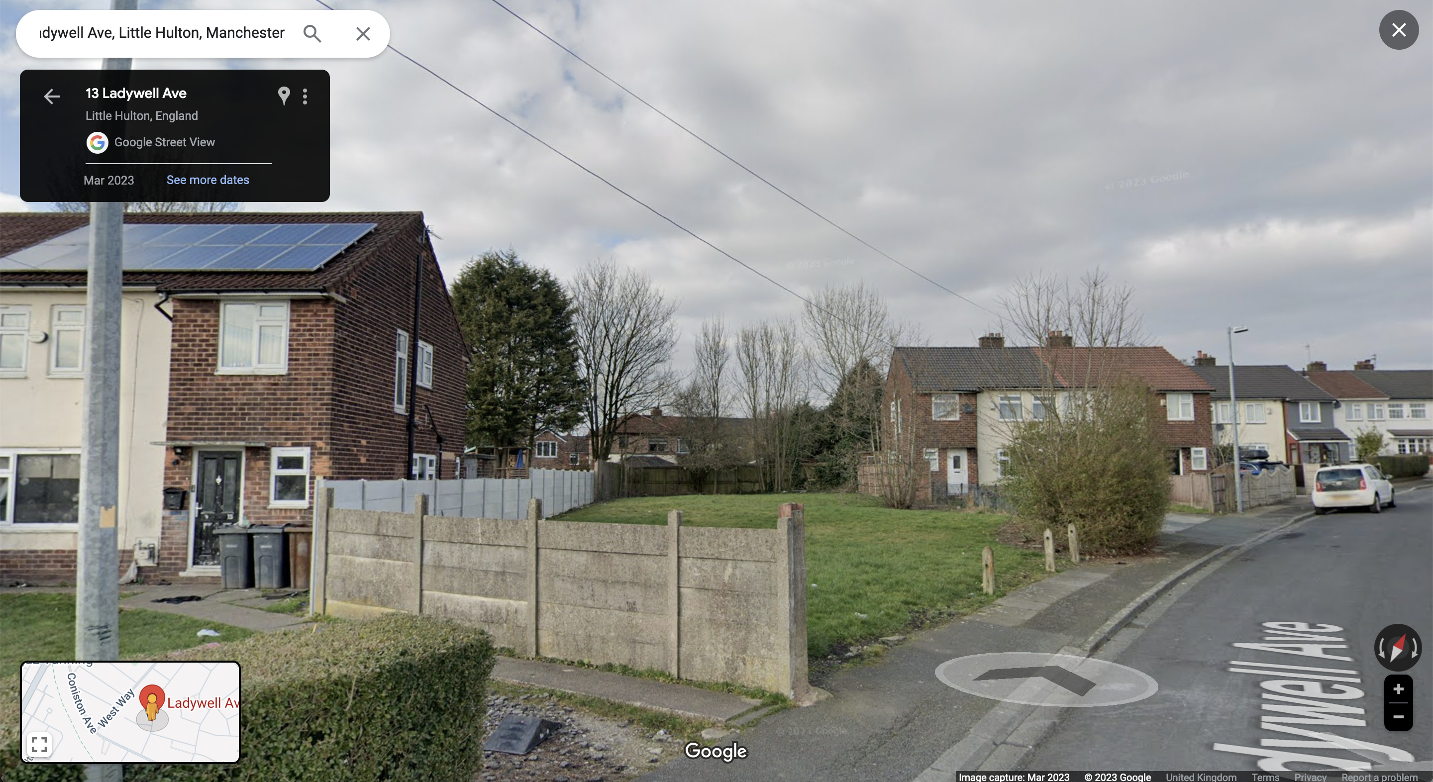 an empty lot between rows of semi-detached houses